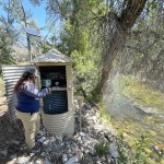 Olivia Griffin, a hydrographer water commissioner with the State Engineer's Office, checks water levels at a Shell Creek stilling well near the mouth of Shell Canyon on Monday morning. “We check water almost every day whether it’s a stilling well, weir, headgate, or a ditch,” she said. Lisa Kunkel