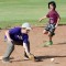 Greybull’s Ryker Johnson fields a ball as Otto’s Jade Bennett runs the bases last Thursday at the Greybull Elementary School ballfield. Lisa Kunkel