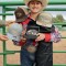 Lincoln Shepperson, of Shell, stands with his awards at the conclusion of the Big Horn Rodeo Circuit Finals last Saturday afternoon in Thermopolis. Shepperson was named the youth all-around cowboy for the BHRC. Kaluha Patterson