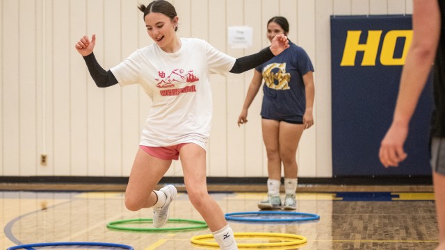 Reagan Vigil hula hoop-hops in a volleyball conditioning exercise at Buff Gym on Monday, Aug. 17. Avery Howe