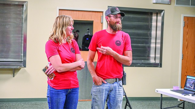 North Captain Wes Mangus (right) addresses the audience to express his thanks to Morgan DuFort, who ramrodded the Defender Service Awards effort for Big Horn County SAR and has also performed a lot of grant writing for the squad. David Peck